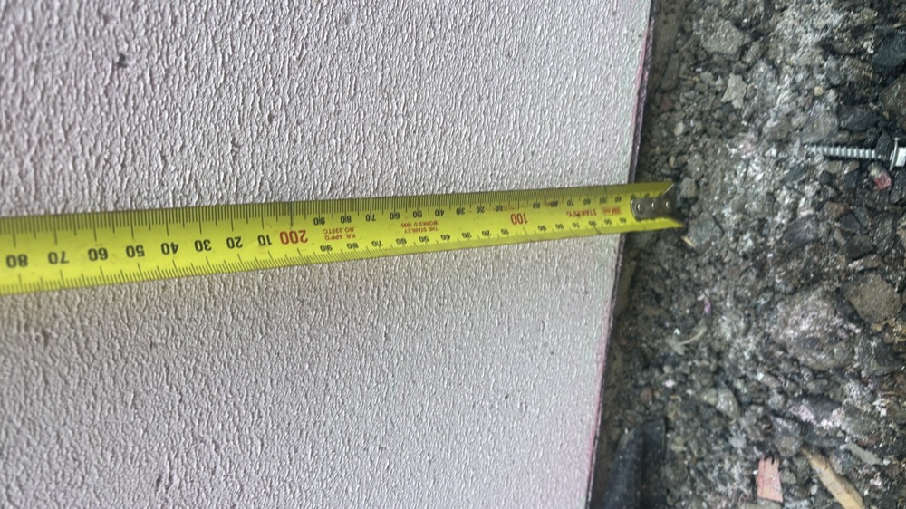 Clearance between wall cladding and ground below the minimum, found during a lock-up inspection in Mickleham
